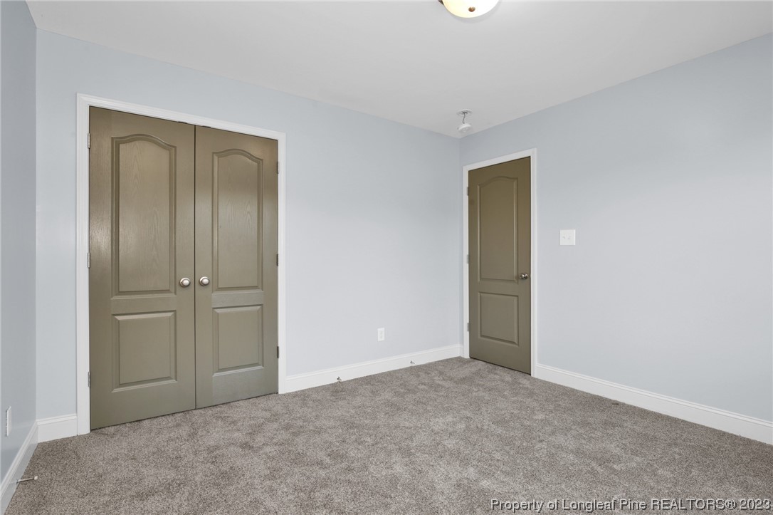 159 Boswell Street Raeford, NC 28376 - Photo 27 of 34 an empty room with closet area