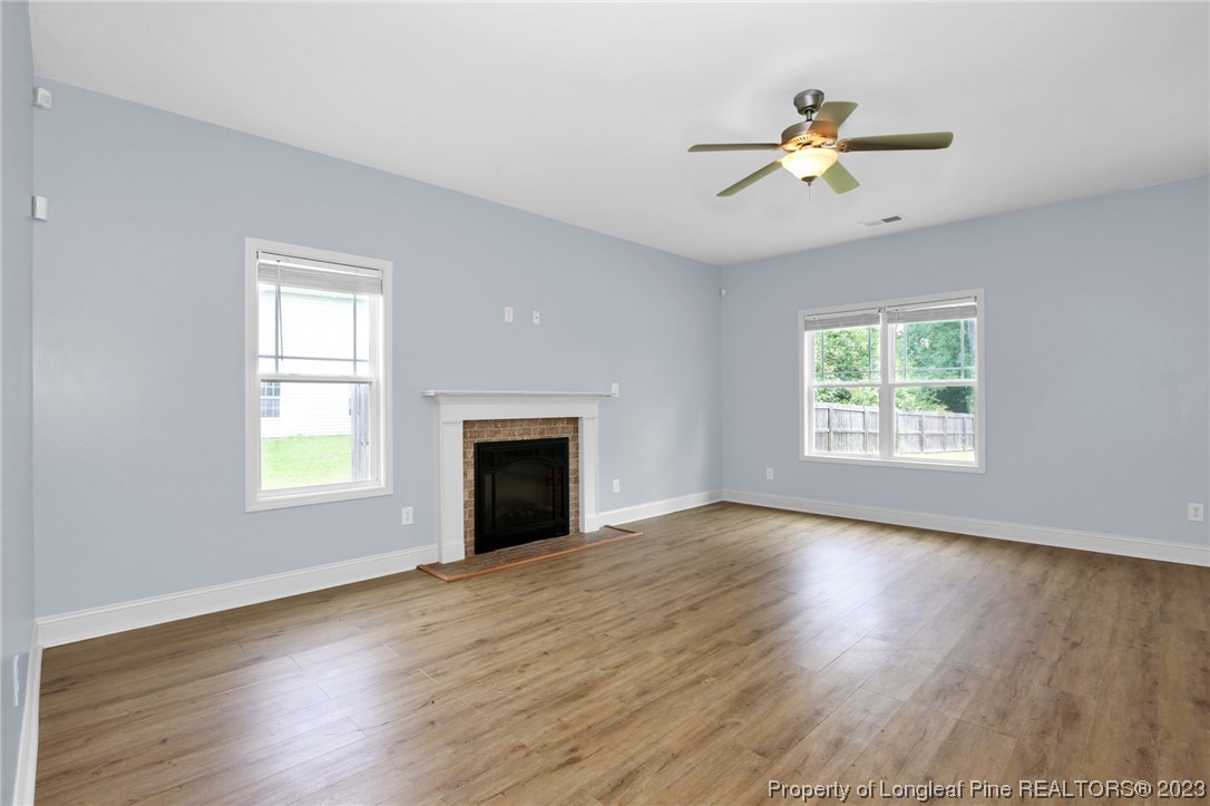 159 Boswell Street Raeford, NC 28376 - Photo 6 of 34 a view of an empty room with wooden floor and a window
