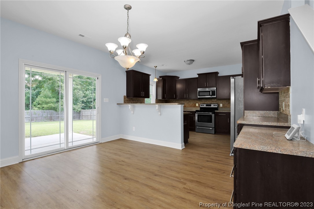 159 Boswell Street Raeford, NC 28376 - Photo 10 of 34 a view of a kitchen with a sink and microwave