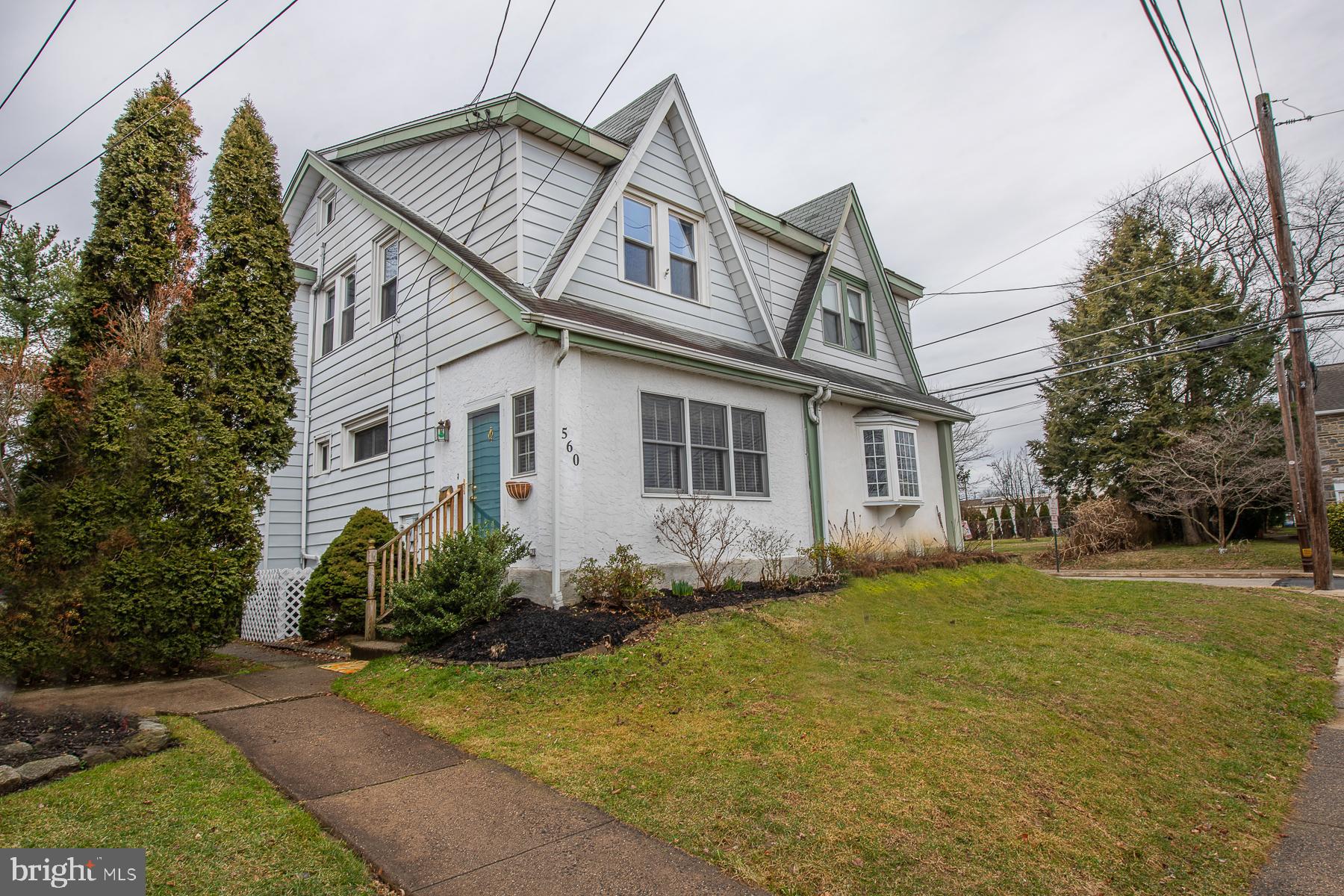 560 Wales Road Havertown, PA 19083 - Photo 2 of 69 a front view of a house with a garden
