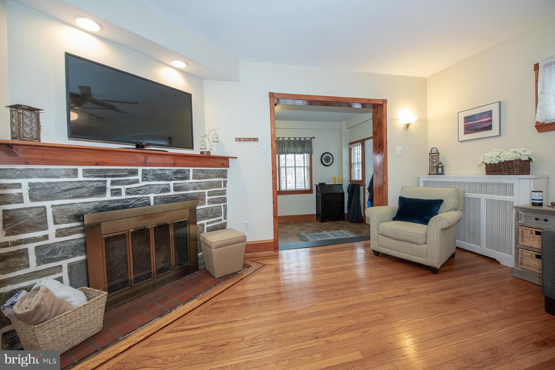 560 Wales Road Havertown, PA 19083 - Photo 15 of 69 a living room with fireplace furniture and a flat screen tv
