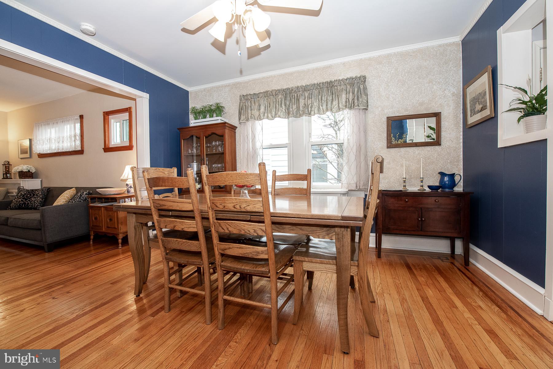 560 Wales Road Havertown, PA 19083 - Photo 21 of 69 a dining room with furniture a chandelier and wooden floor