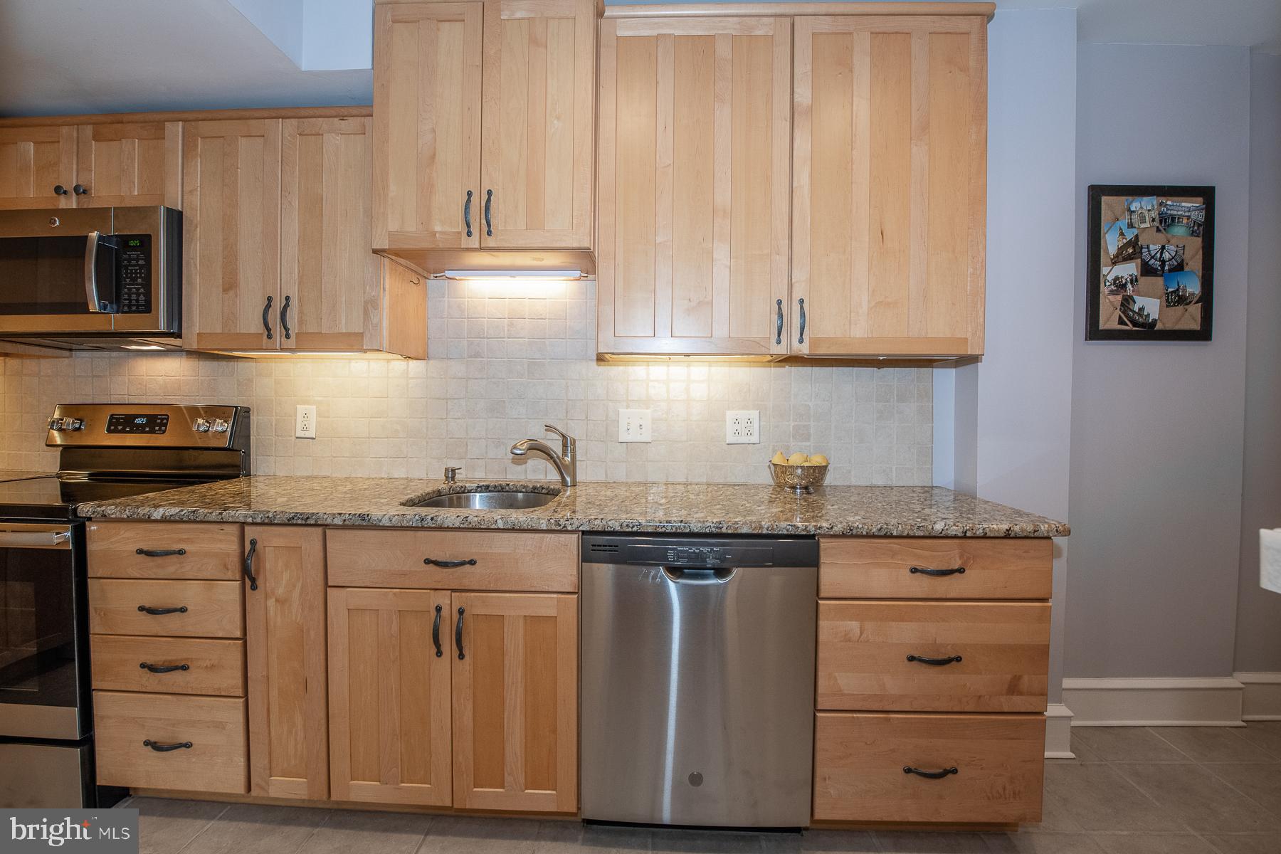 560 Wales Road Havertown, PA 19083 - Photo 25 of 69 a kitchen with granite countertop a sink cabinets and stainless steel appliances