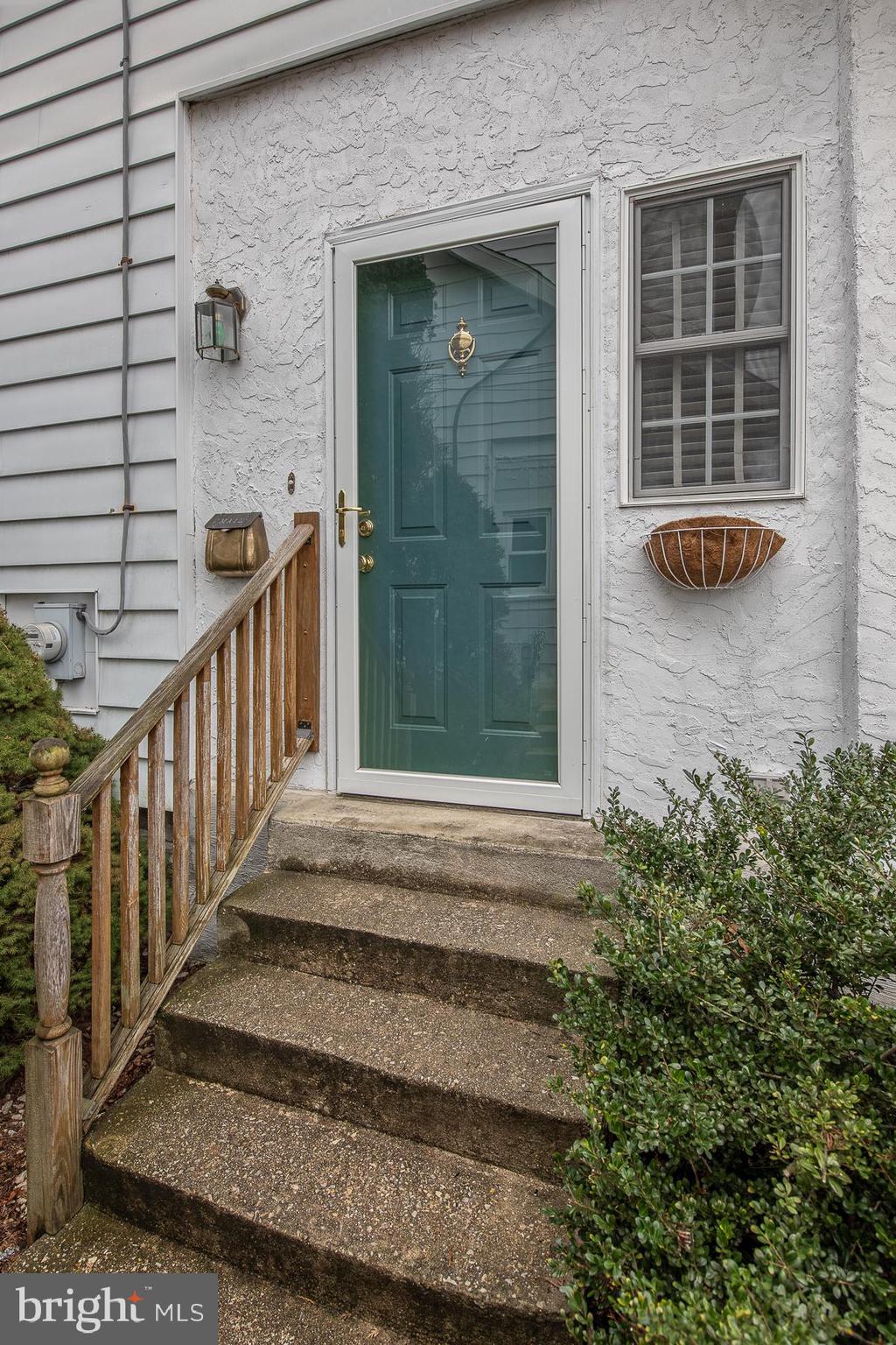 560 Wales Road Havertown, PA 19083 - Photo 4 of 69 a view of a house with a large window and wooden fence