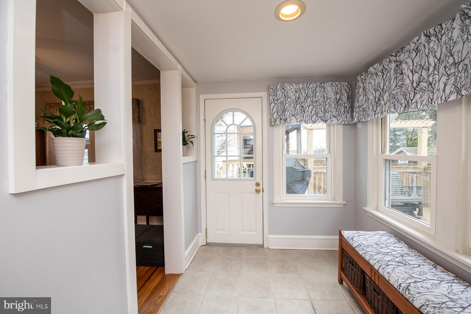 560 Wales Road Havertown, PA 19083 - Photo 32 of 69 a view of an entryway with wooden floor and a livingroom