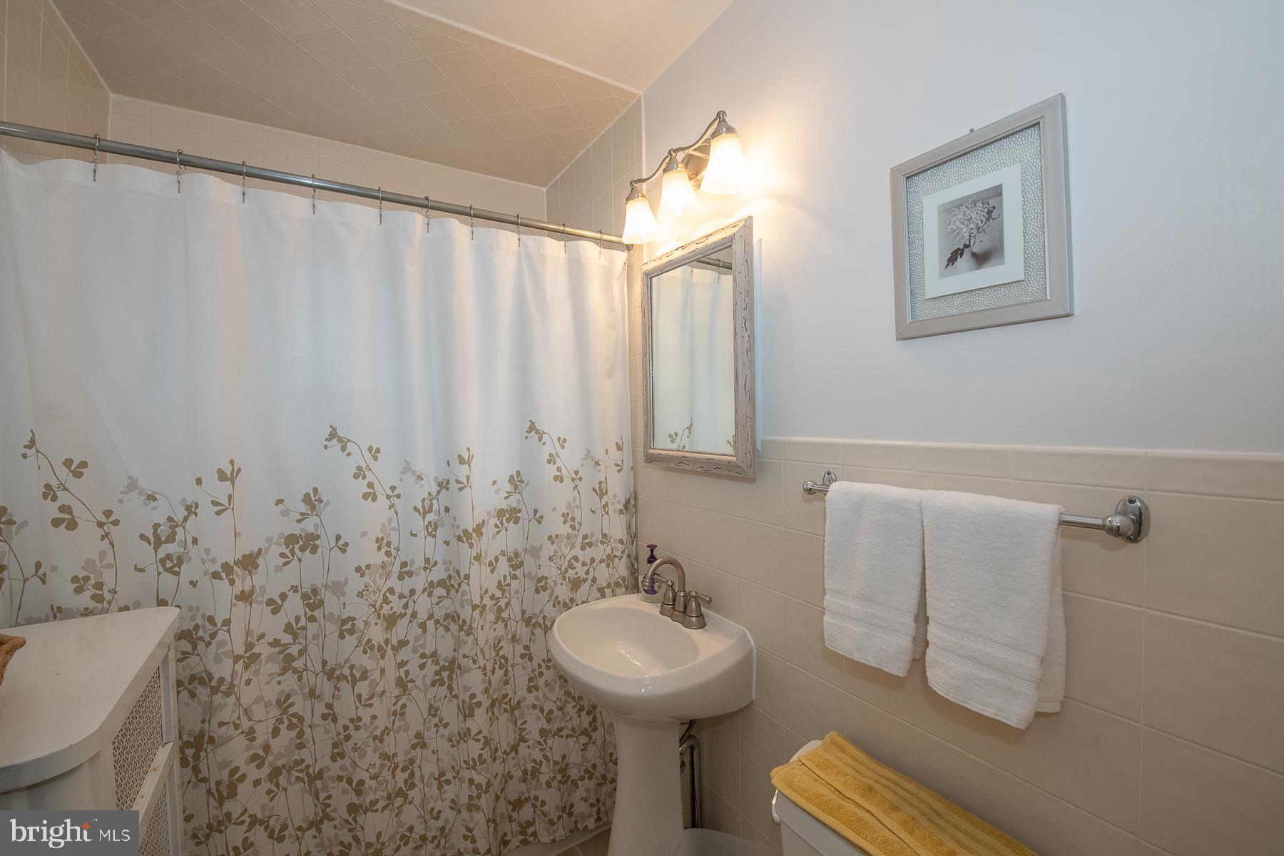 560 Wales Road Havertown, PA 19083 - Photo 45 of 69 a bathroom with a sink toilet and a mirror