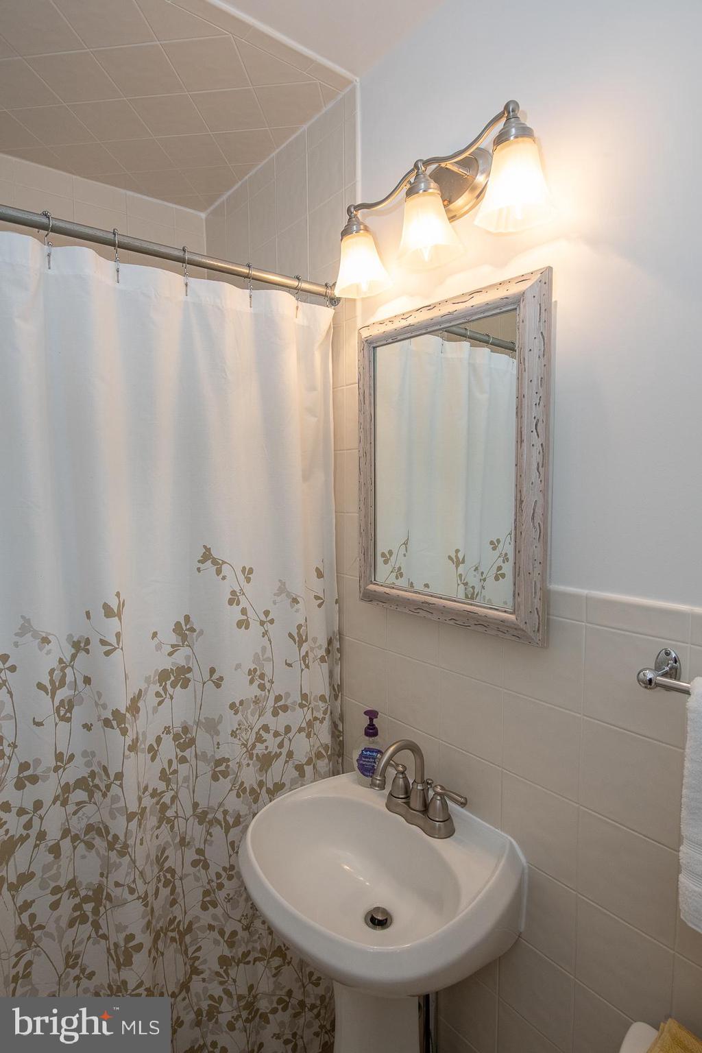 560 Wales Road Havertown, PA 19083 - Photo 46 of 69 a bathroom with a sink and a mirror