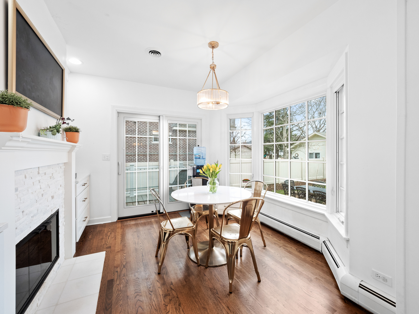 530 Grand Boulevard Park Ridge, IL 60068 - Photo 17 of 55 a dining room with furniture a fireplace and wooden floor
