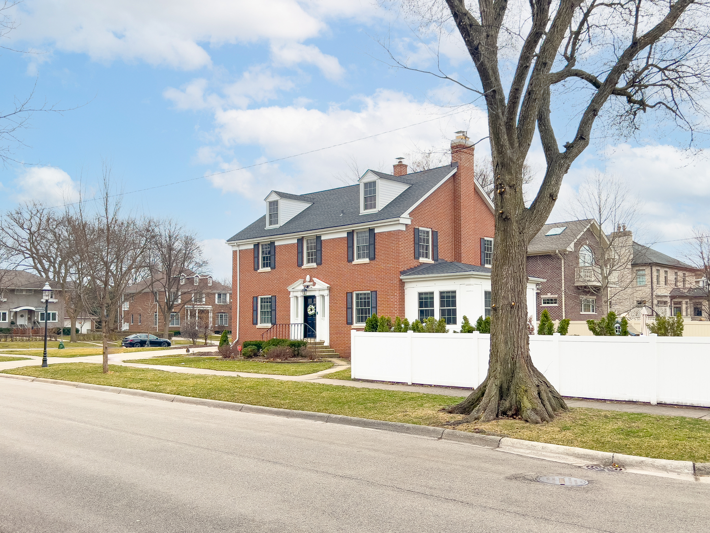 530 Grand Boulevard Park Ridge, IL 60068 - Photo 2 of 55 a view of a white house with a large trees