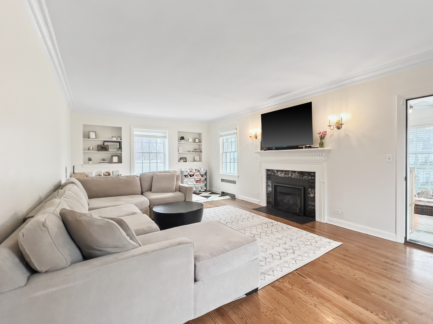 530 Grand Boulevard Park Ridge, IL 60068 - Photo 9 of 55 a living room with furniture a flat screen tv and a fireplace