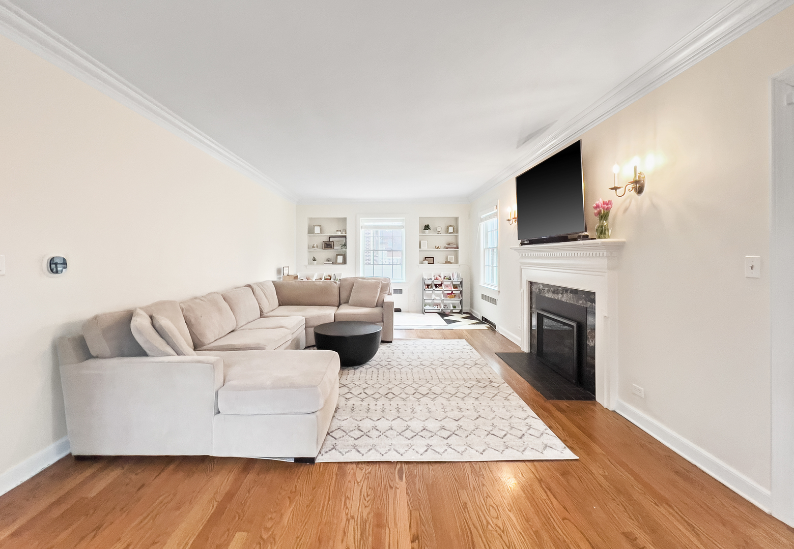 530 Grand Boulevard Park Ridge, IL 60068 - Photo 10 of 55 a living room with furniture a flat screen tv and a fireplace