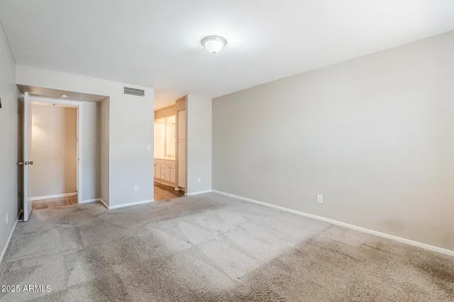 a view of an empty room and window