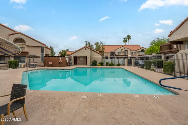 an aerial view of a house with swimming pool