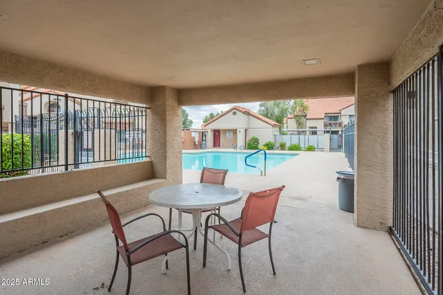 a view of a dining room with furniture window and outside view