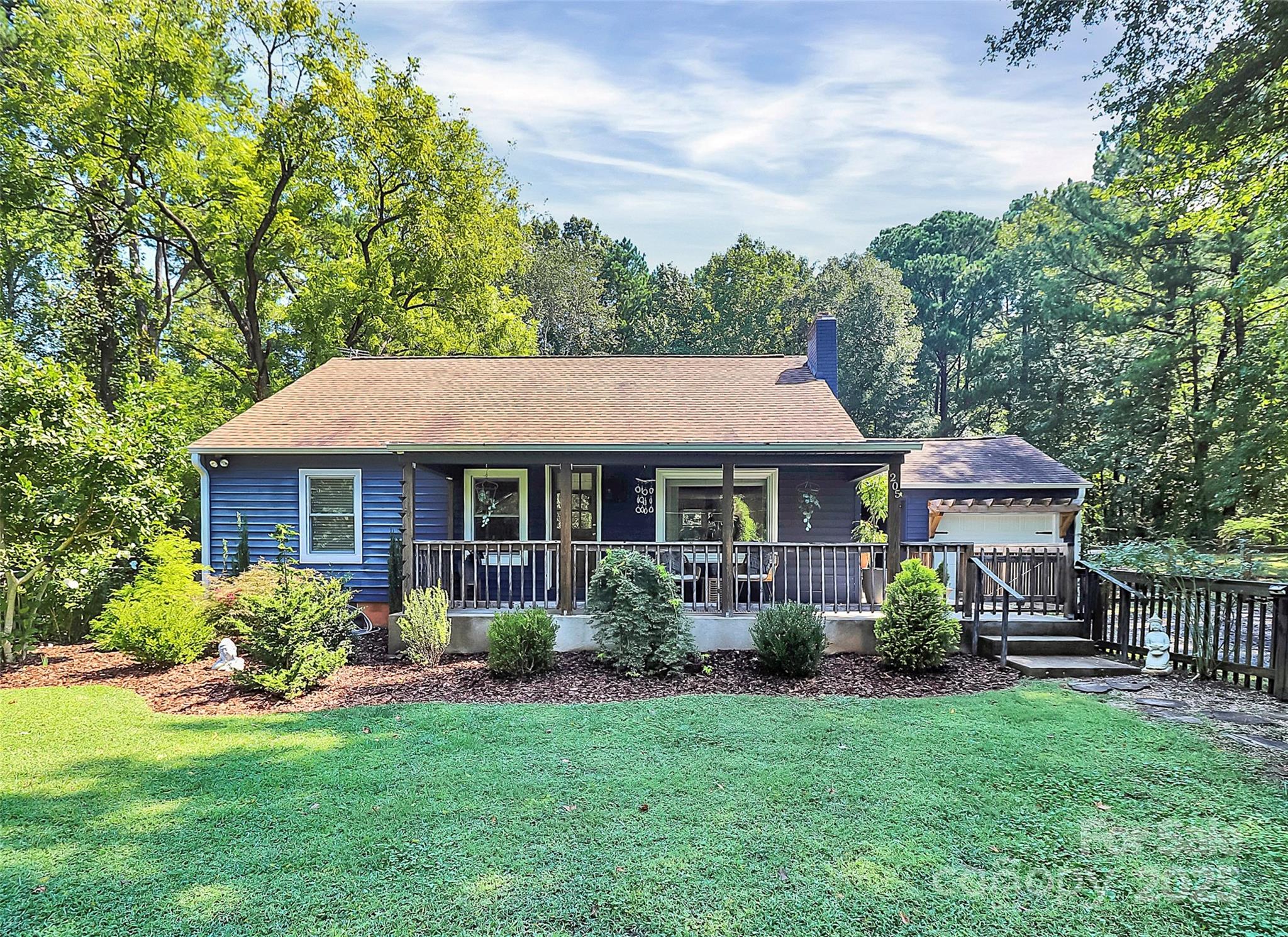 205 Mason Street Belmont, NC 28012 - Photo 1 of 27 a front view of a house with garden