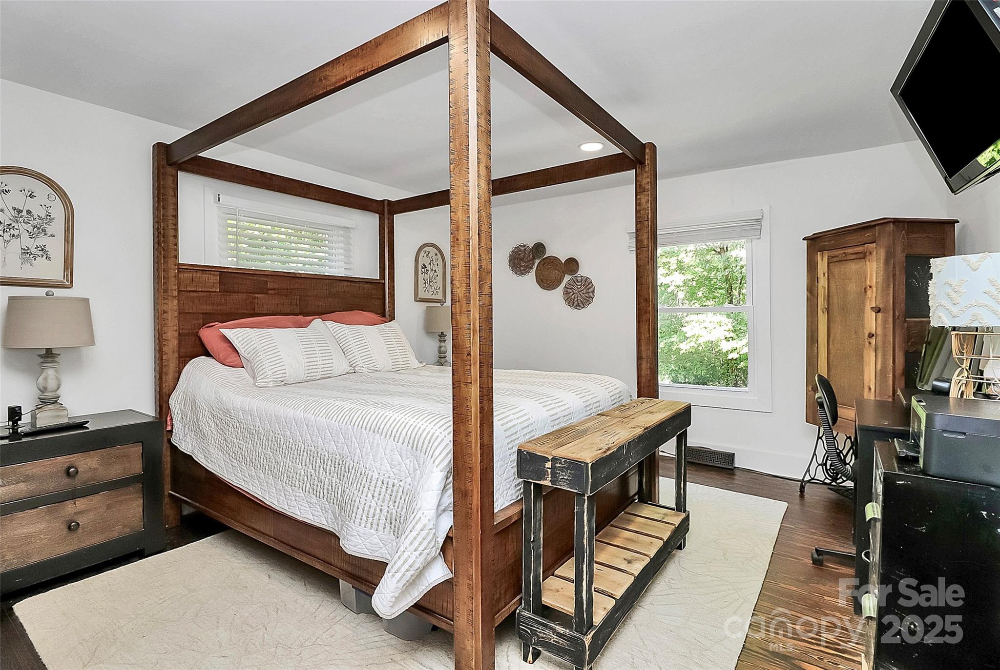205 Mason Street Belmont, NC 28012 - Photo 12 of 27 a bedroom with a bed a flat screen tv and windows