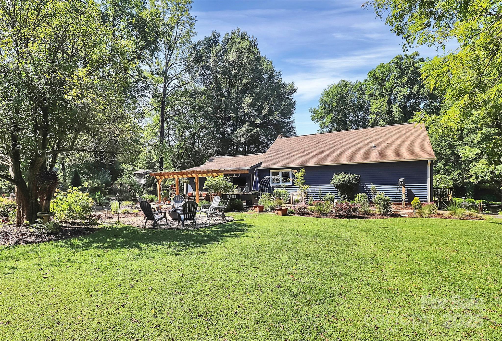 205 Mason Street Belmont, NC 28012 - Photo 25 of 27 a view of a house with garden and sitting area