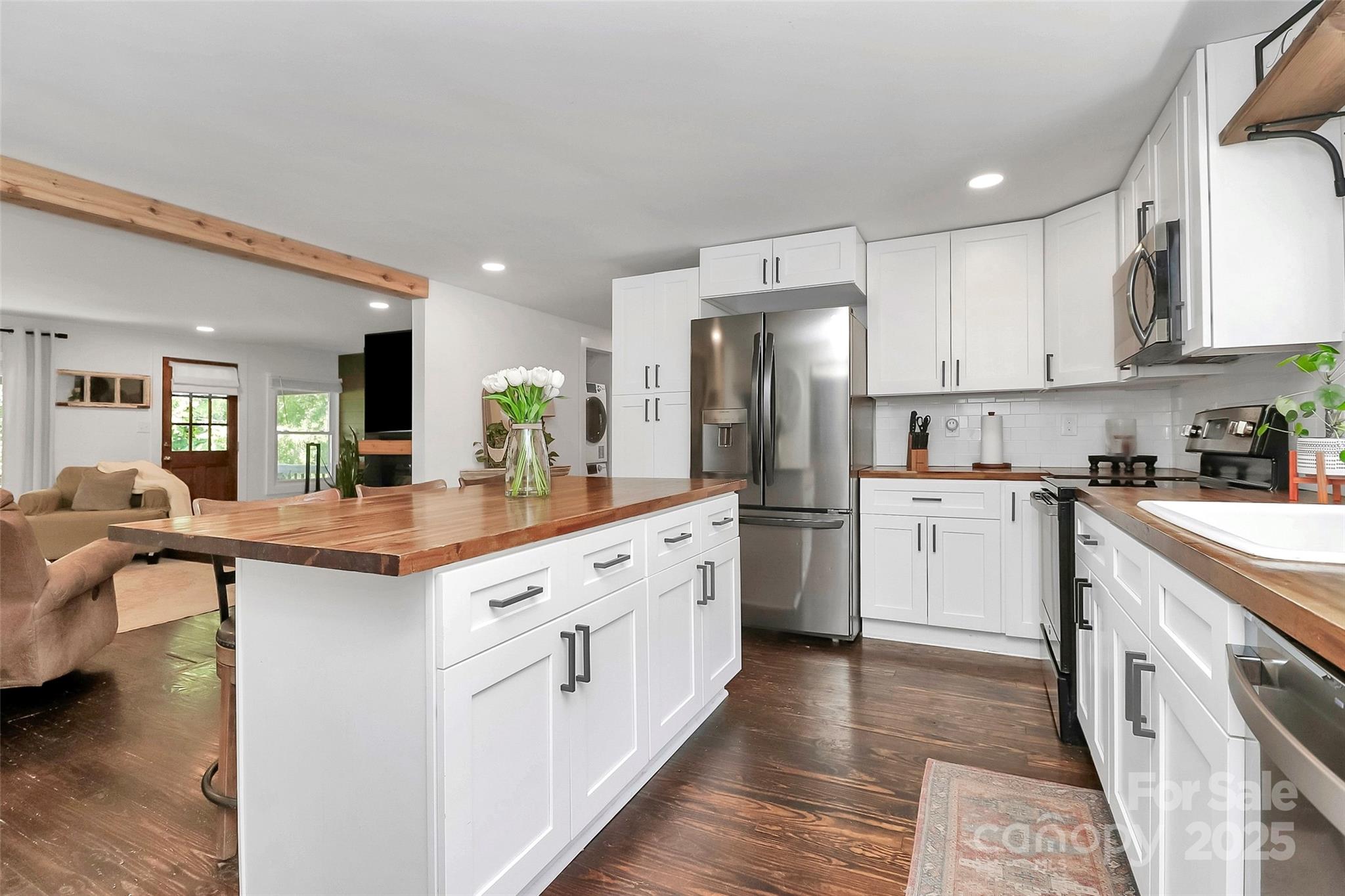 205 Mason Street Belmont, NC 28012 - Photo 7 of 27 a kitchen with white cabinets and sink