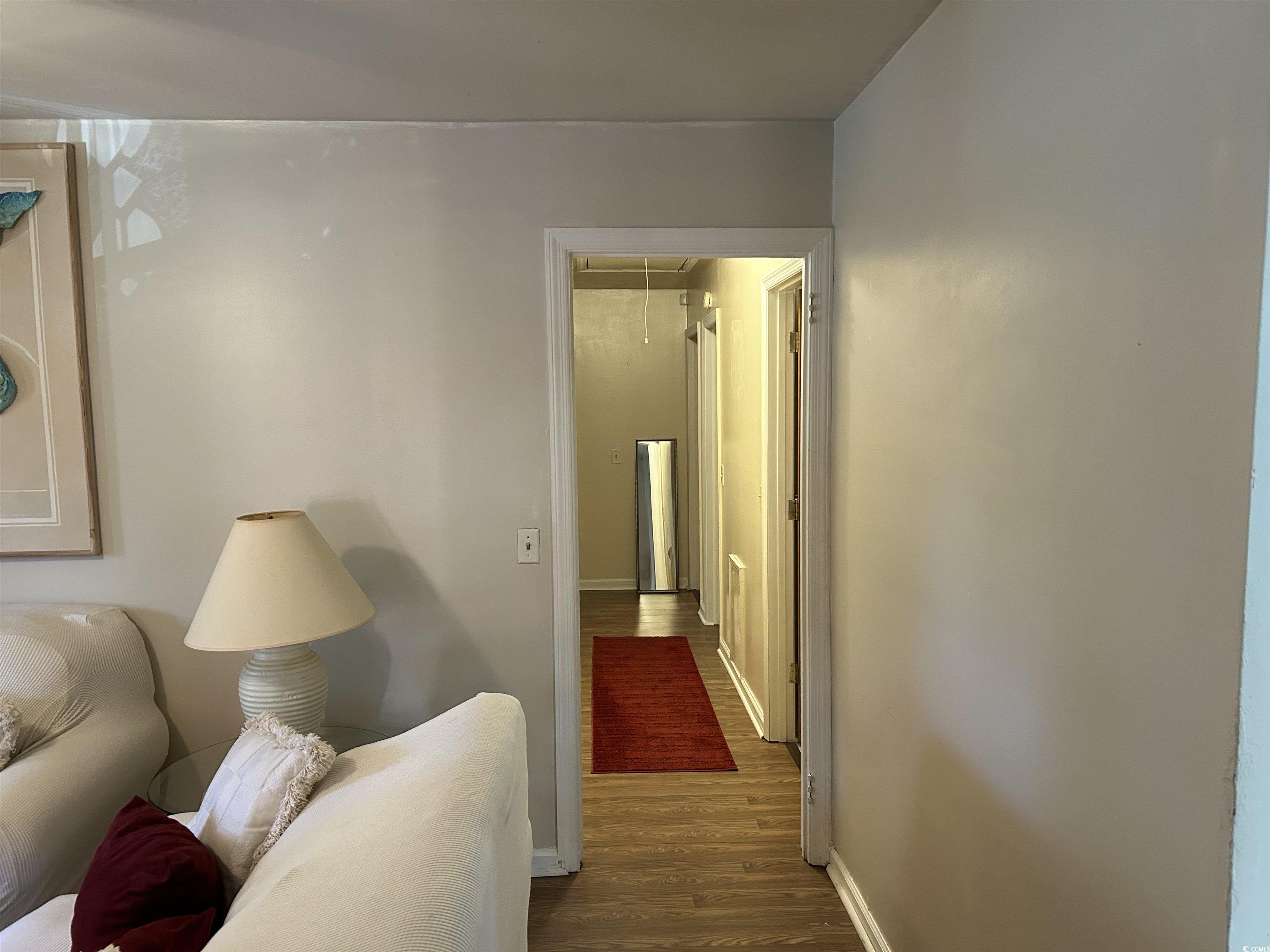 1411 East Harrison Street Dillon, SC 29536 - Photo 21 of 40 Hall featuring attic access and dark wood finished floors