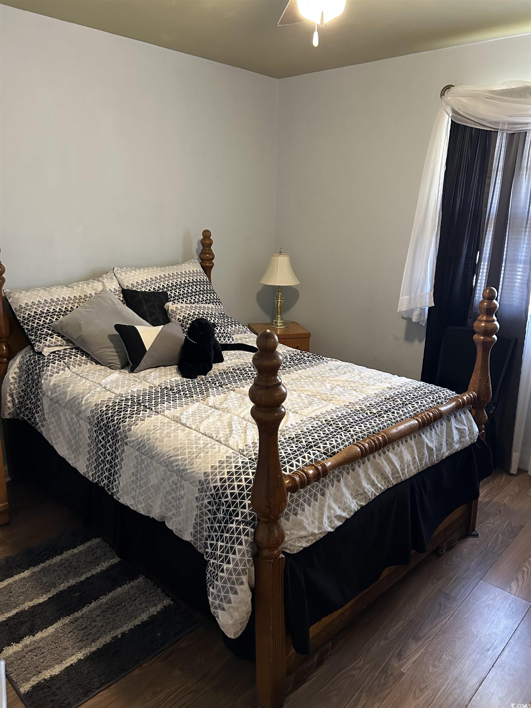 1411 East Harrison Street Dillon, SC 29536 - Photo 25 of 40 Bedroom featuring wood finished floors and a ceiling fan