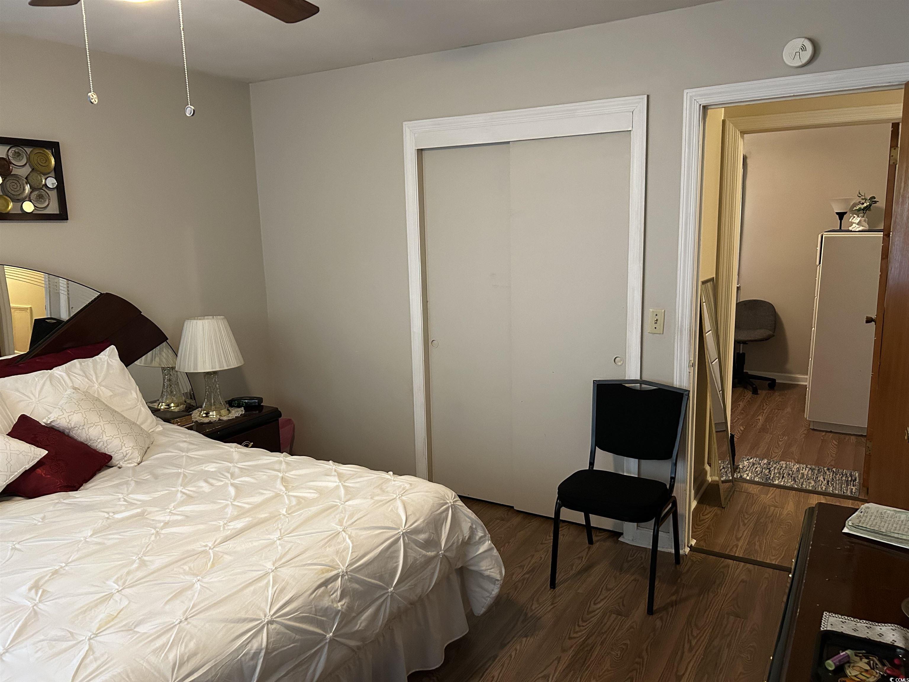 1411 East Harrison Street Dillon, SC 29536 - Photo 34 of 40 Bedroom with dark wood-type flooring, a closet, and ceiling fan