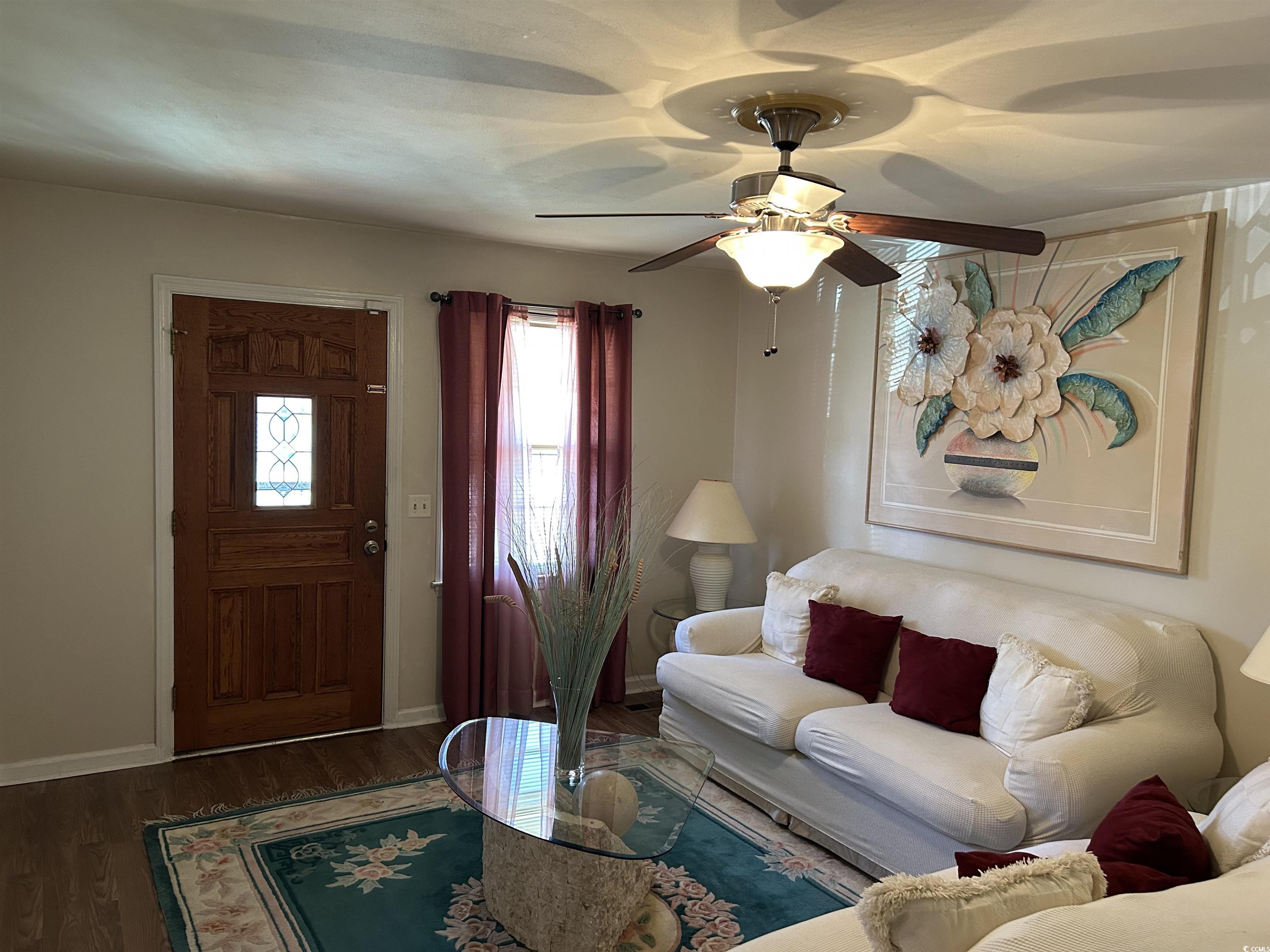 1411 East Harrison Street Dillon, SC 29536 - Photo 7 of 40 Living room featuring wood finished floors and ceiling fan