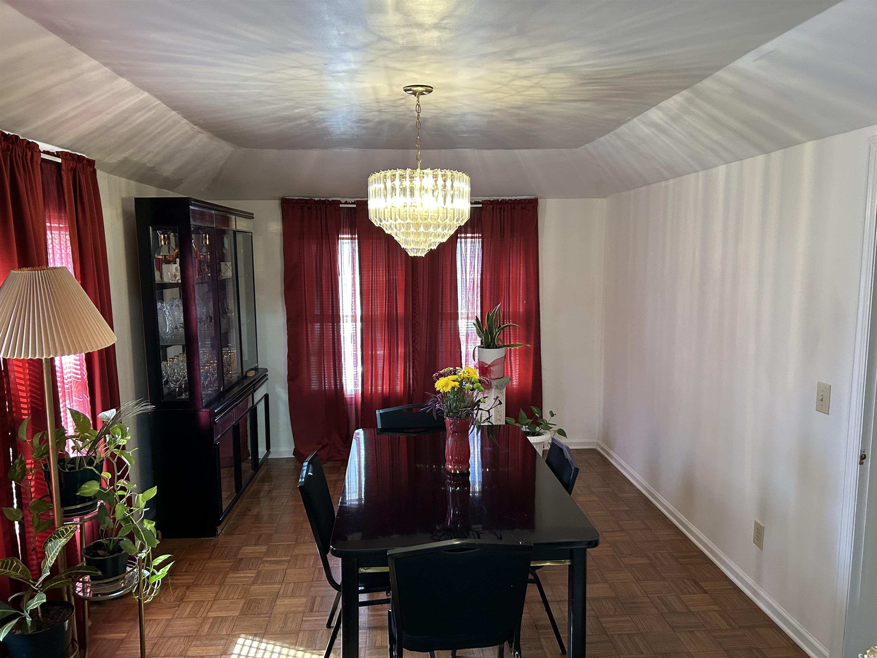 1411 East Harrison Street Dillon, SC 29536 - Photo 9 of 40 Dining space with a chandelier and baseboards