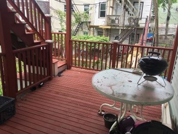 203 Lexington Street Boston, MA 02128 - Photo 18 of 24 a roof deck view with a seating space