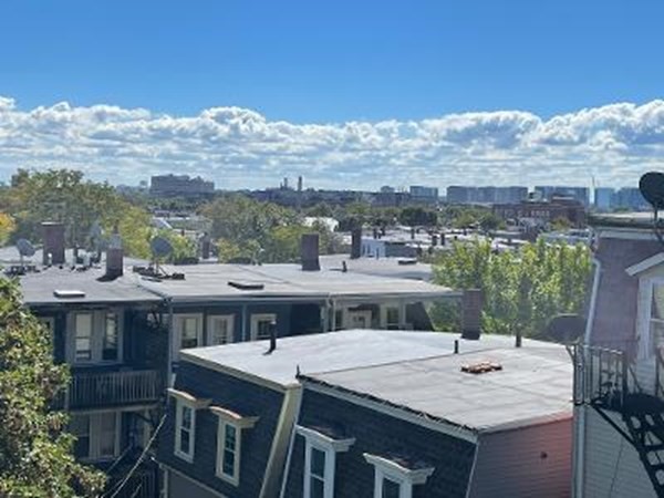 203 Lexington Street Boston, MA 02128 - Photo 24 of 24 a view of a house with a terrace