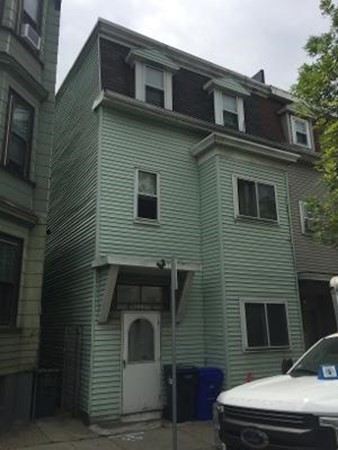 203 Lexington Street Boston, MA 02128 - Photo 3 of 24 a front view of a house with garage