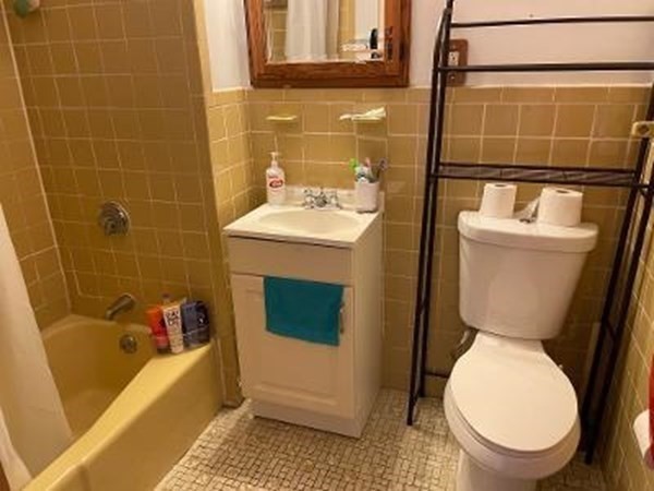 203 Lexington Street Boston, MA 02128 - Photo 7 of 24 a bathroom with a sink and a toilet