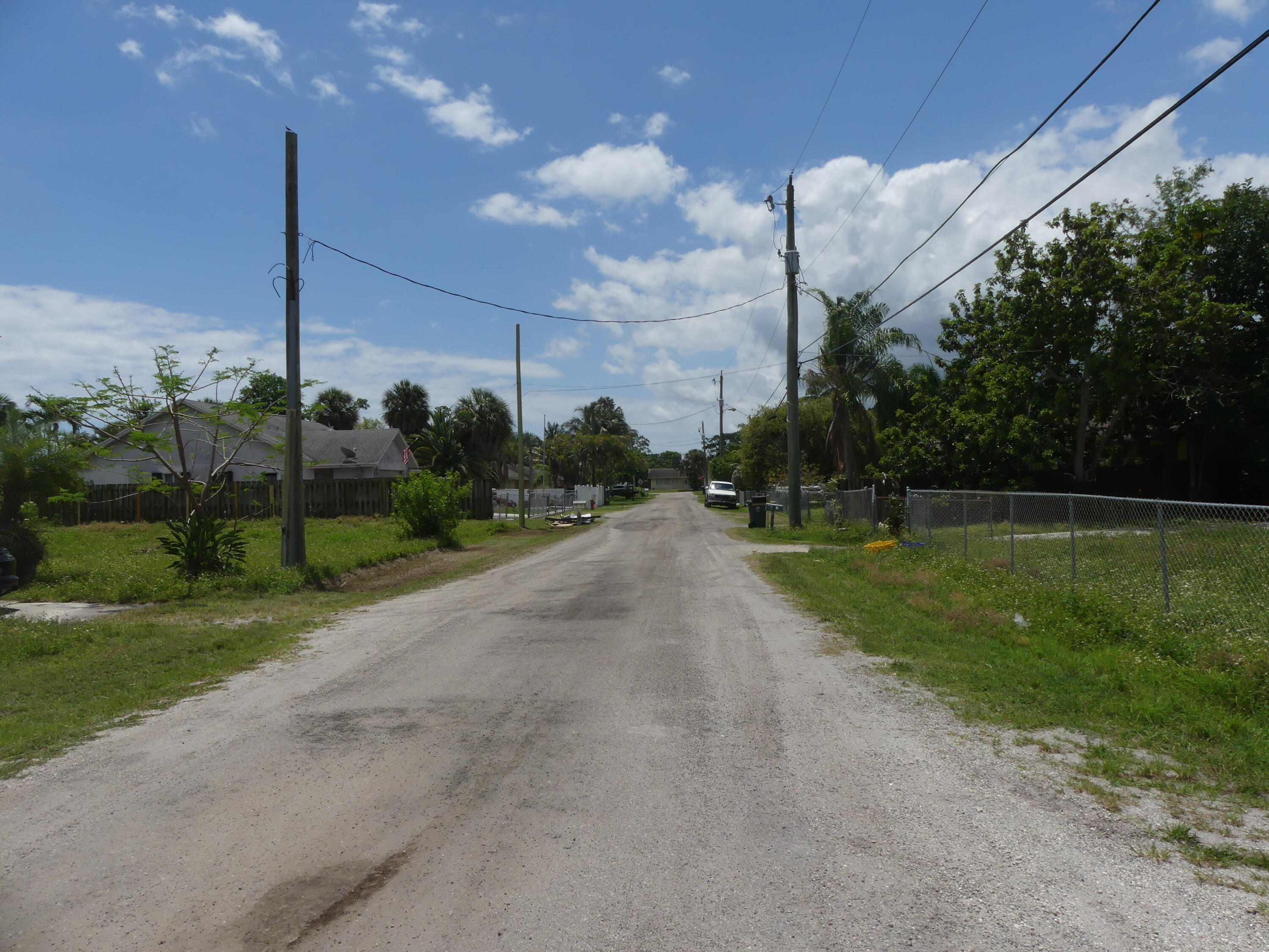 6633 Rigger Road Lake Worth, FL 33462 - Photo 6 of 28 a view of a road with a play ground in front of it