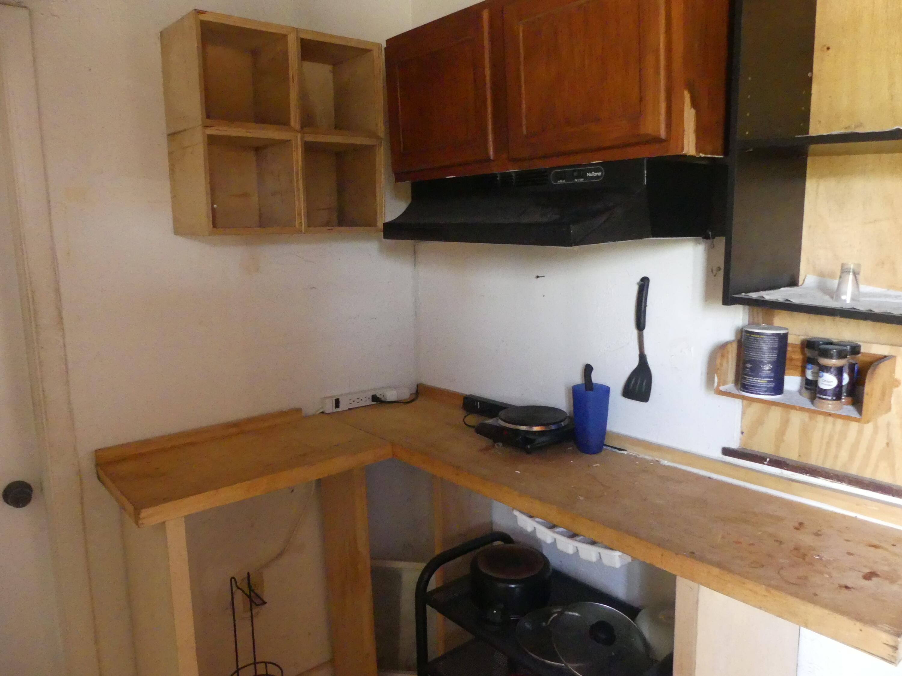 6633 Rigger Road Lake Worth, FL 33462 - Photo 7 of 28 a kitchen with a sink and cabinets