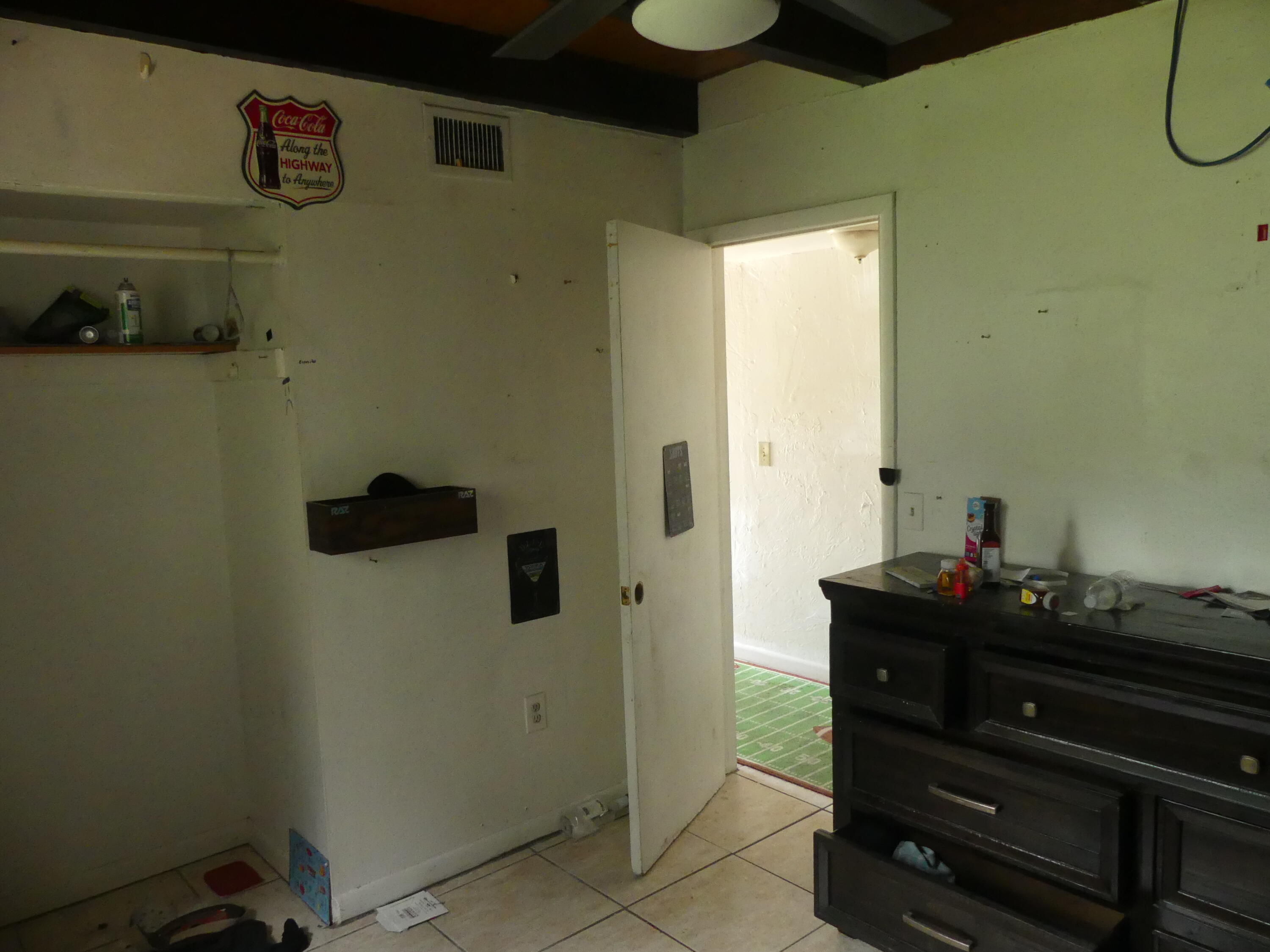 6633 Rigger Road Lake Worth, FL 33462 - Photo 9 of 28 a bathroom with a sink and a mirror