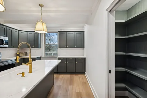 a room with cabinets and wooden floor