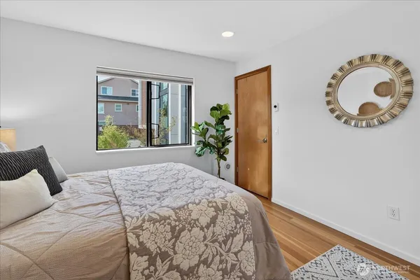 a bedroom with a bed and a window