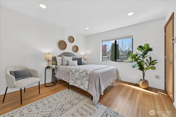 a bedroom with a bed and window