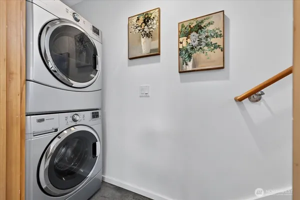 a view of a hallway with washer and dryer