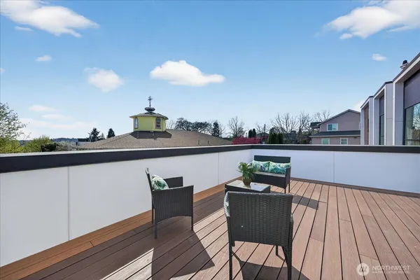 a view of a balcony with furniture