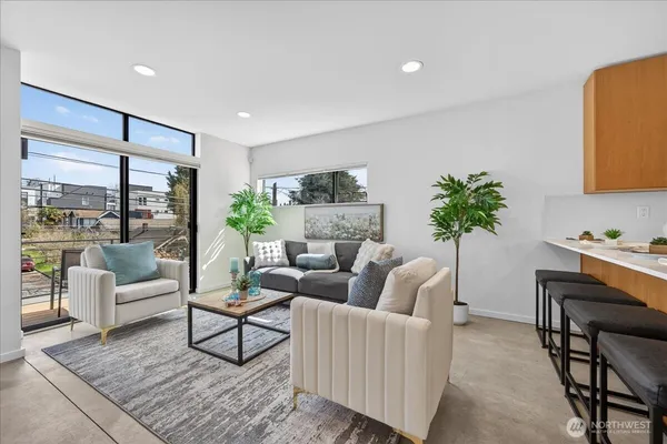 a living room with furniture and a large window