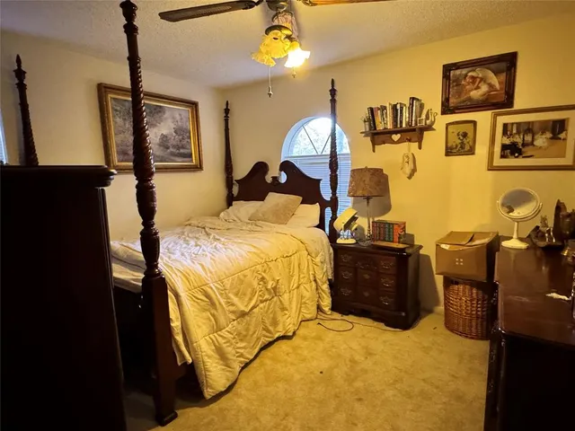 a bed room with a bed and a lamp