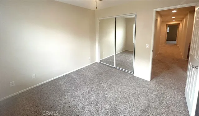 an empty room with mirror in it