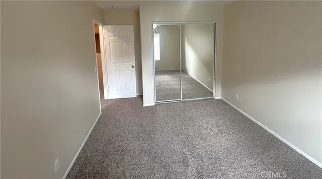 an empty room with a bathroom