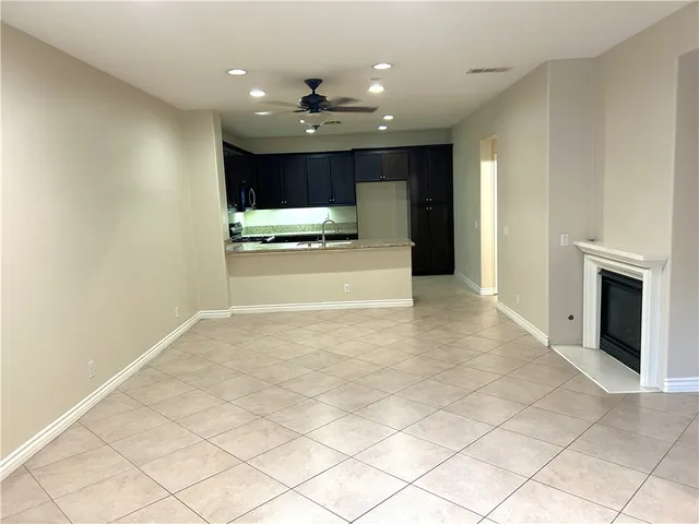 a view of an empty room with a fireplace