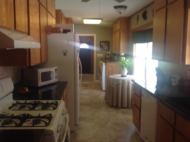 1868 Upper River Road Macon, GA 31211 - Photo 13 of 33 a kitchen with stainless steel appliances granite countertop a refrigerator stove and sink