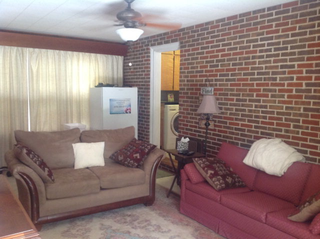 1868 Upper River Road Macon, GA 31211 - Photo 16 of 33 a living room with furniture and a large window