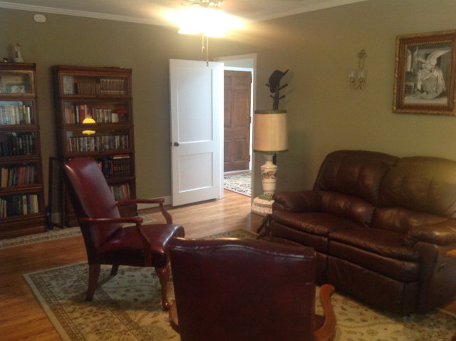 1868 Upper River Road Macon, GA 31211 - Photo 9 of 33 a living room with furniture and a lamp