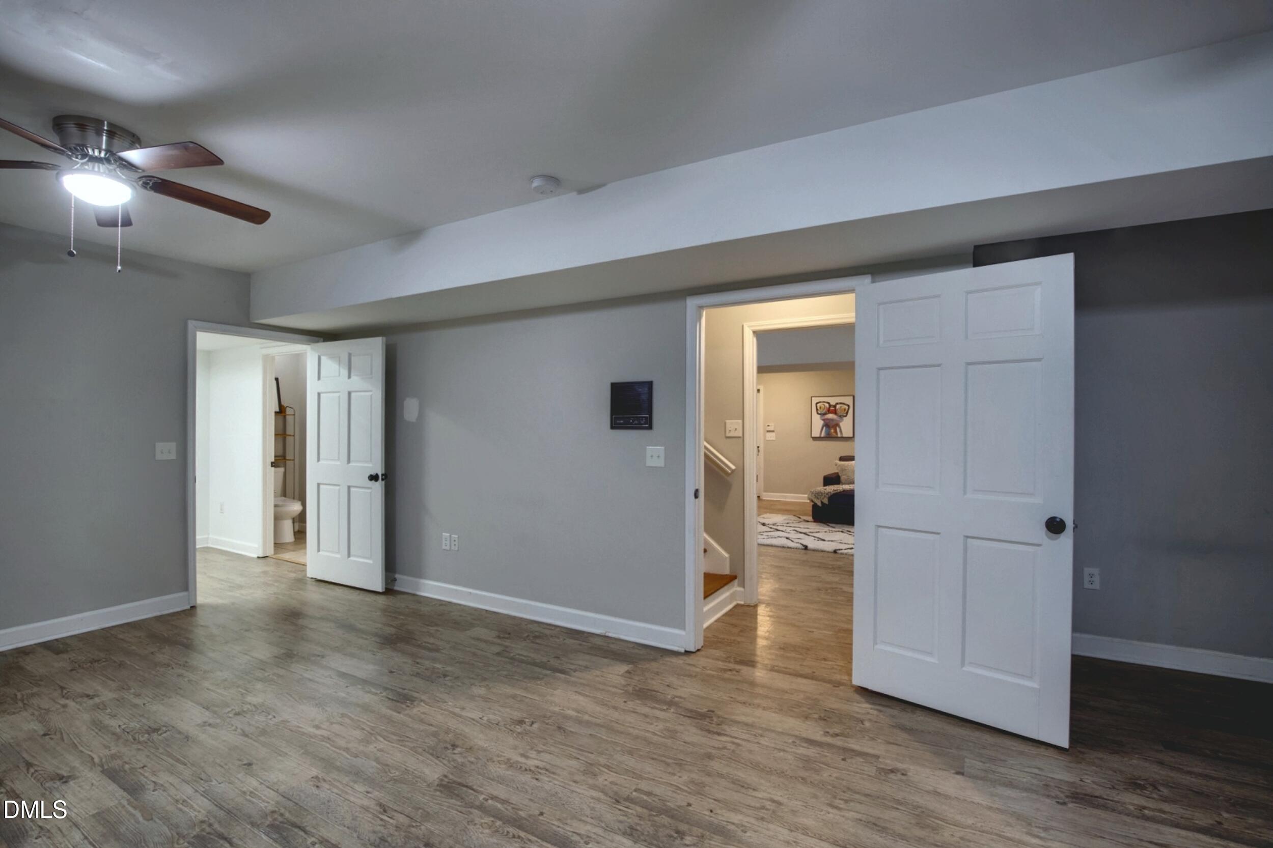 2329 Win Road Garner, NC 27529 - Photo 63 of 90 Wood-finish flooring, recessed lighting, ceiling fan, white paneled doors, and light gray wall finish