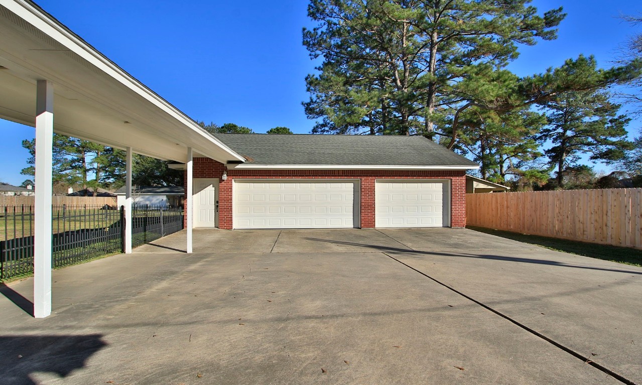 30610 Quinn Road Tomball, TX 77375 - Photo 47 of 50 Coverd porch from the home to the 3 car garage.