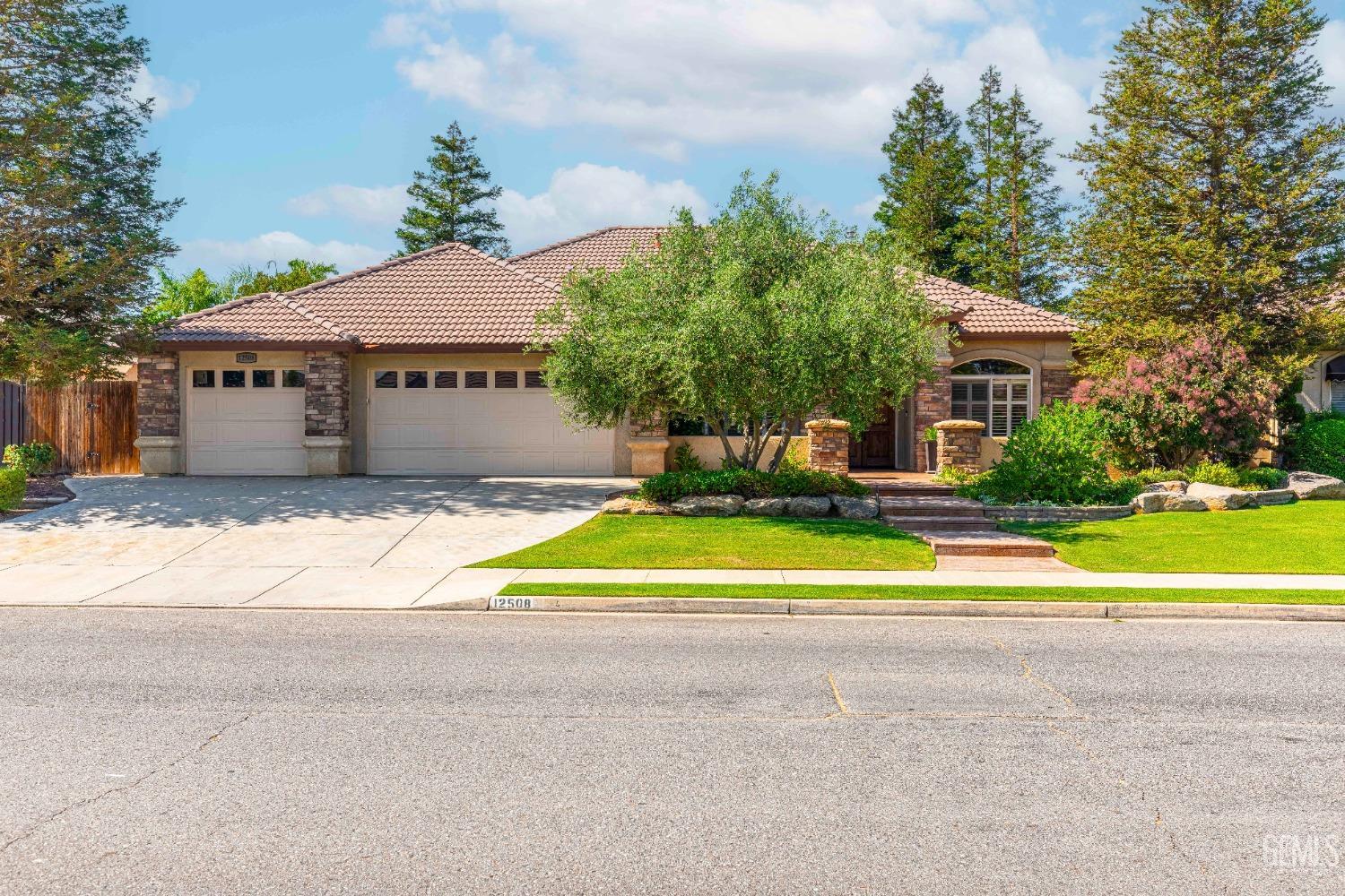 a view of swimming pool in front of house